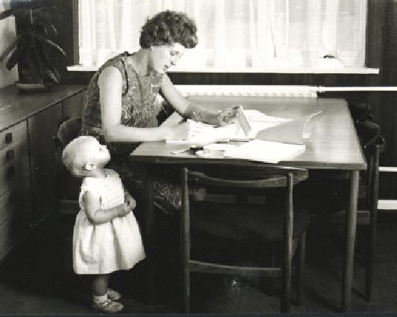 Ann Moffatt in 1966, at which time she was one of the earliest teleworkers employed by Steve Shirley's company FPL. In this 1966 image Ann is seen writing programs to analyse Concorde's Black Box recorder. Also in the photo is Ann's one year old daughter.