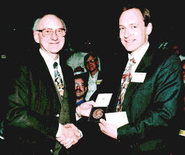 Tim Berners-Lee receiving his medal from Godfrey Stafford