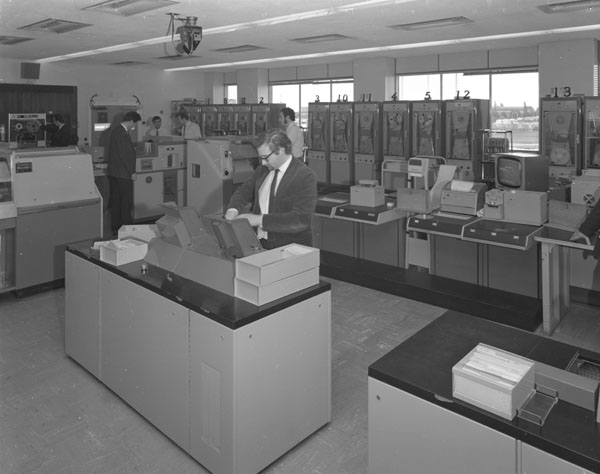 Machine room showing tape readers, card readers, printers, card punch, and magnetic tape decks