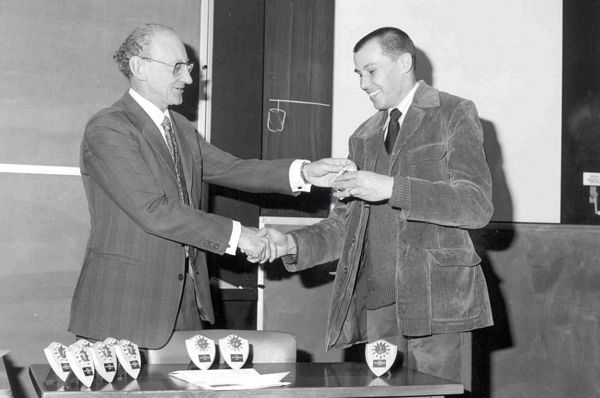 Godfrey Stafford presents SRC Hockey Trophy to Bob Hopgood, the new Division Head, August 1979