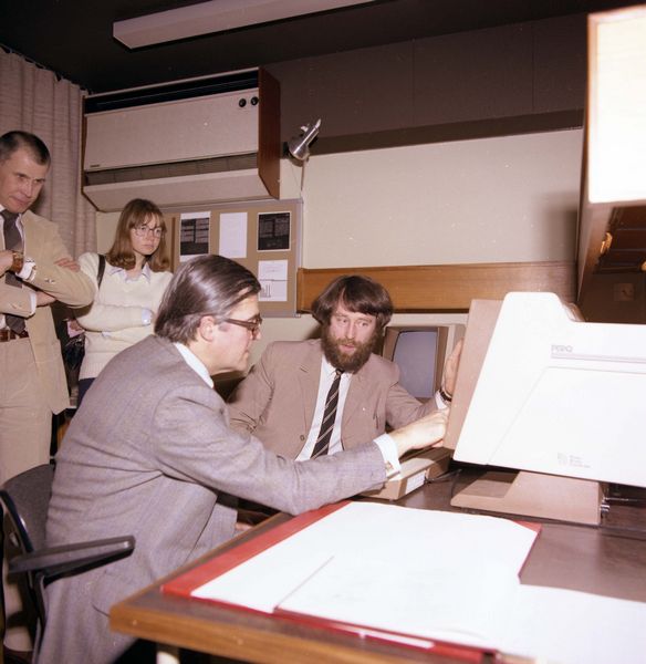 Kenneth Baker being shown the PERQ by Jed Brown, Bob Hopgood looks on, March 1982