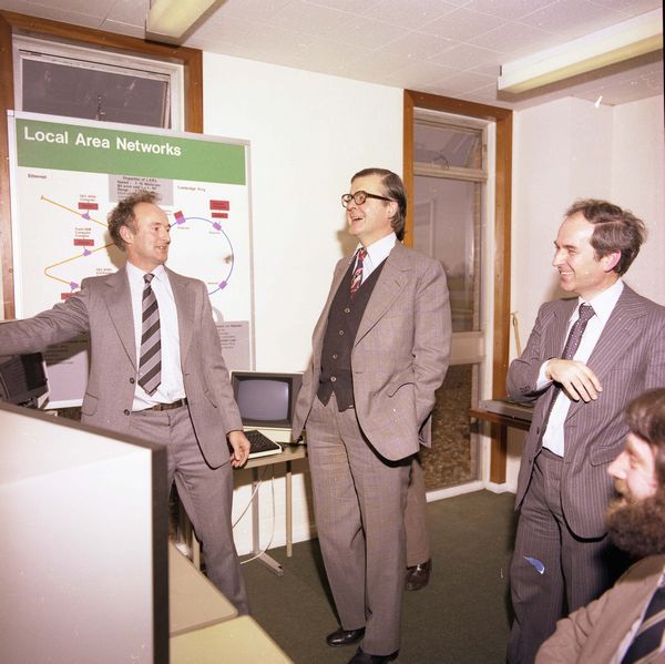 Paul Bryant describing Local area Networks to Kenneth Baker, Geoff Manning looks on, March 1982