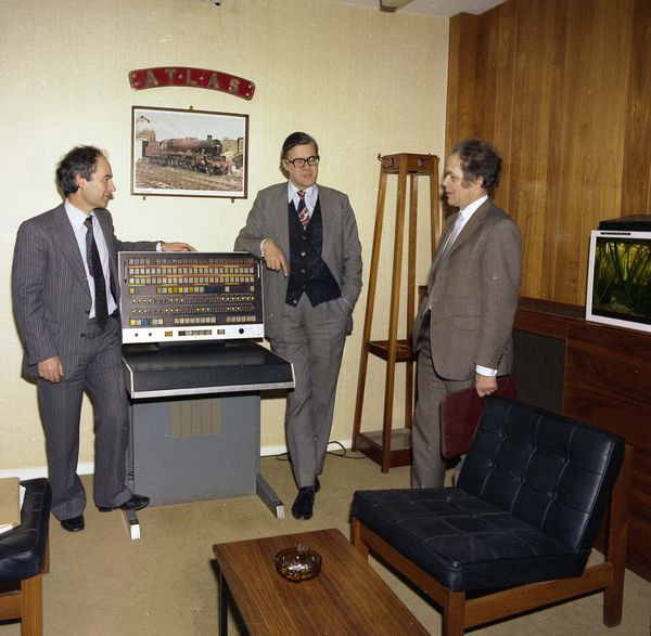 Geoff Manning, Kenneth Baker and Brian Oakley (future Alvey Director) admiring the Atlas Computer Console, March 1982