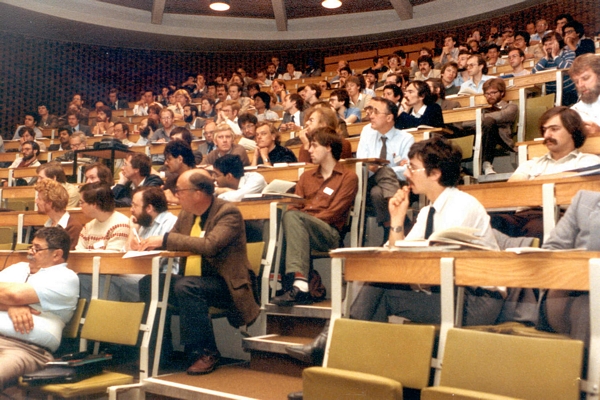DCS Conference, University of Sussex, 1984 (Roger Needham, front row of seats with yellow tie)