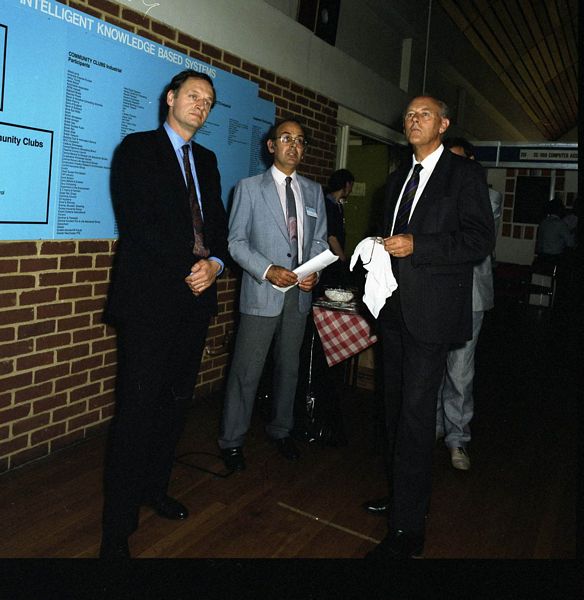 Cliff Pavelin (centre) at the Alvey Conference, Sussex. IKBS Community Clubs Stand behind