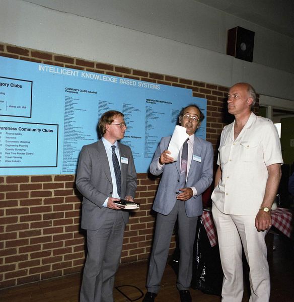 Alvey Conference, Sussex: Left to Right: Tony Dignan (Ferranti), Mike Falla (Software Sciences), Hui Chiu and Mike Russell (RAL) who were part of the Software Engineering team run by David Talbot and Rob Witty. In the white suit behind is Geoffrey Pattie Minister for IT who took over from Ken Baker, July 1986