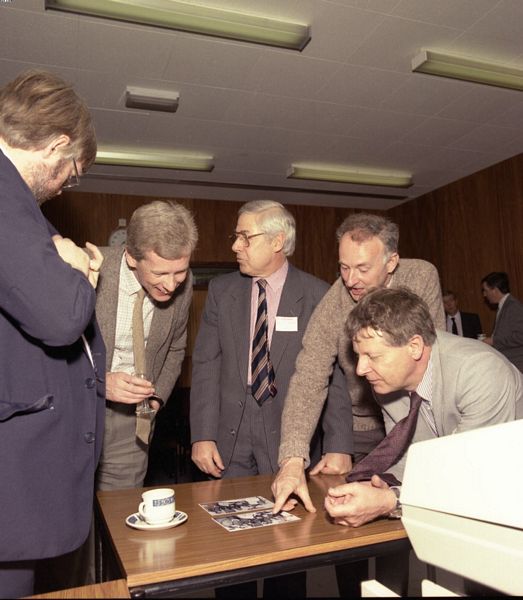 Len Ford, David Boyd, Bill Trowbridge, Paul Bryant and Brian Colyer looking at a photo of the acceptance celebration for the first Prime 400
